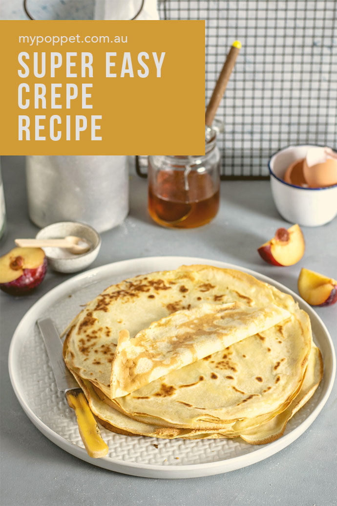 How to make crepes - Plate of stacked crepes with cut nectarine on side