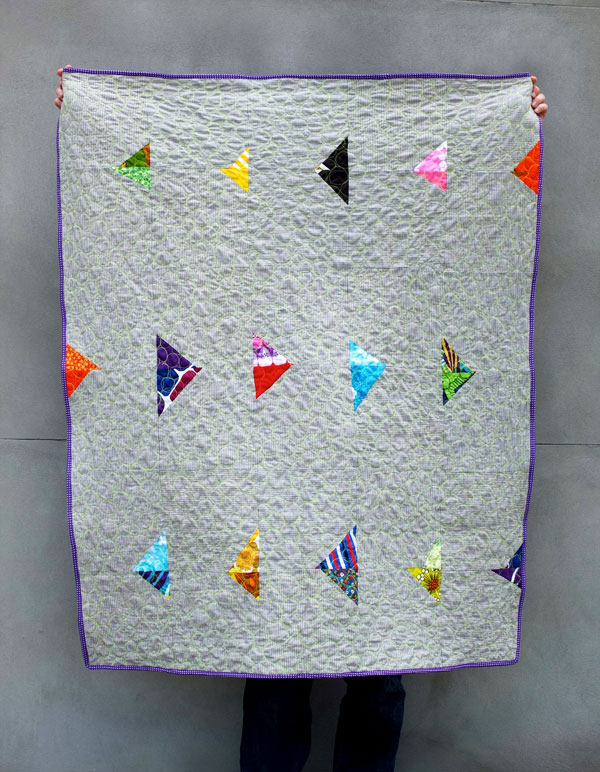 Modern quilt design grey with bright arrows