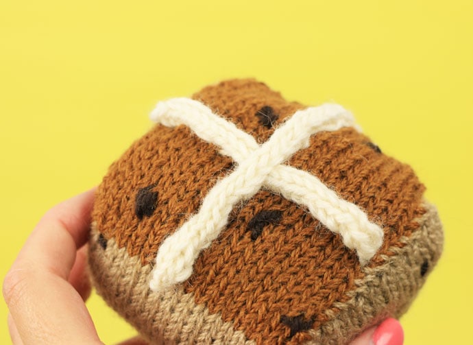 Knitted hot cross bun pattern