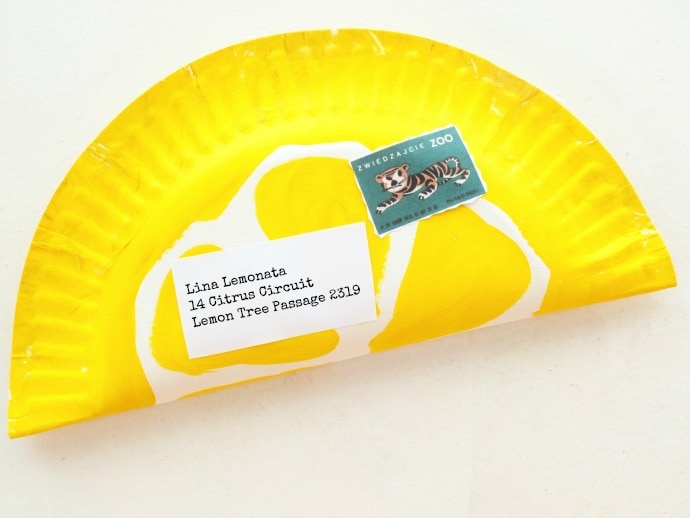 Send a letter in a slice of lemon made from a paper plate