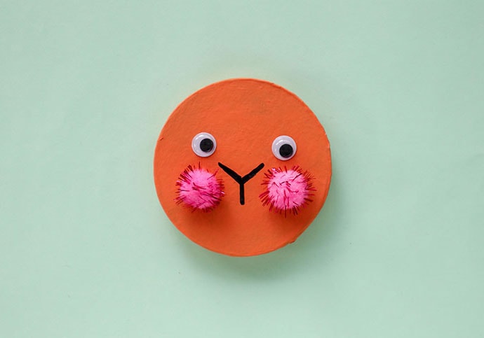 glue on pom pom and eyes to make rabbit face on box