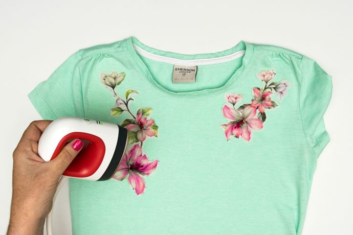 Ironing on floral applique to green tshirt with easy press mini