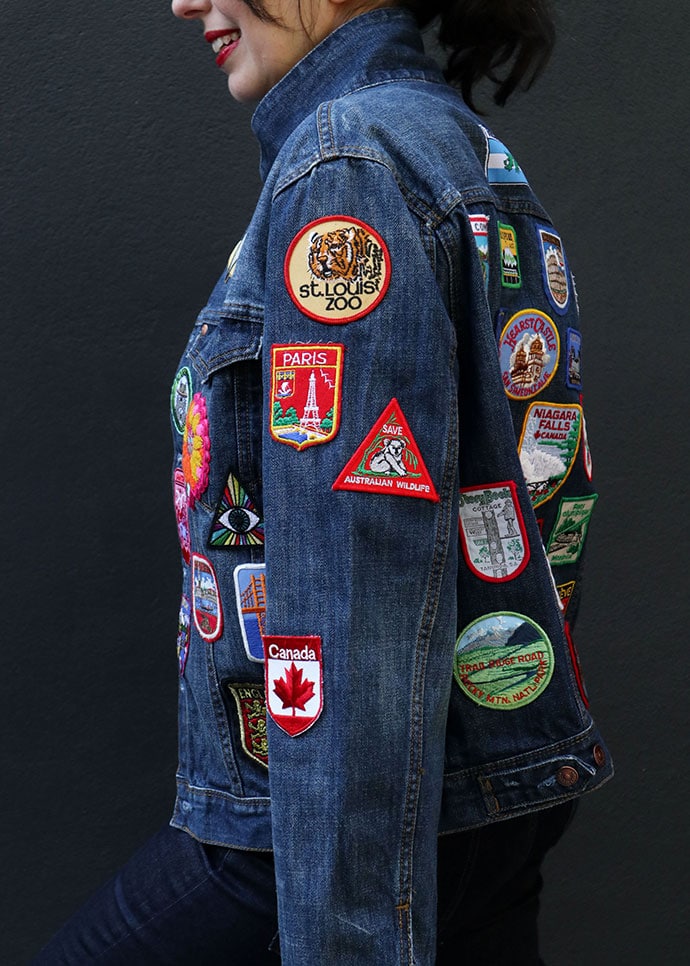 woman wearing denim jacket covered with patches