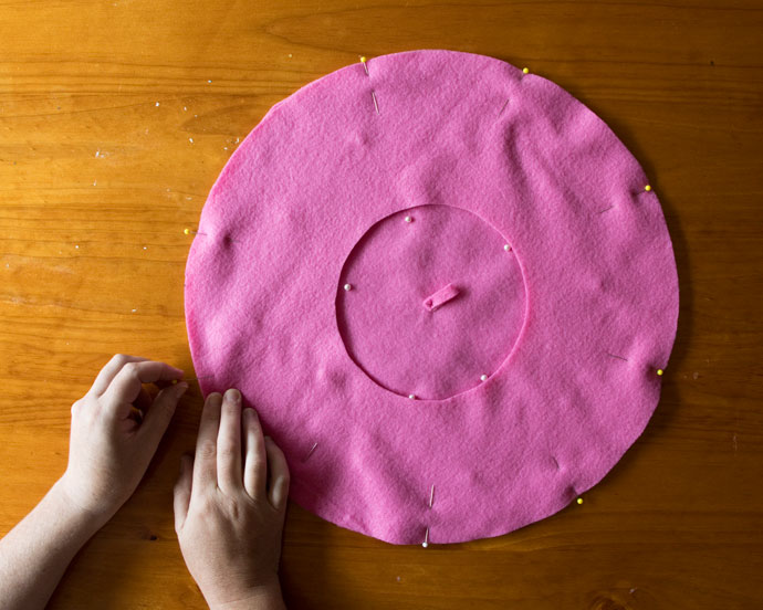 beret pattern pieces cut in pink fabric