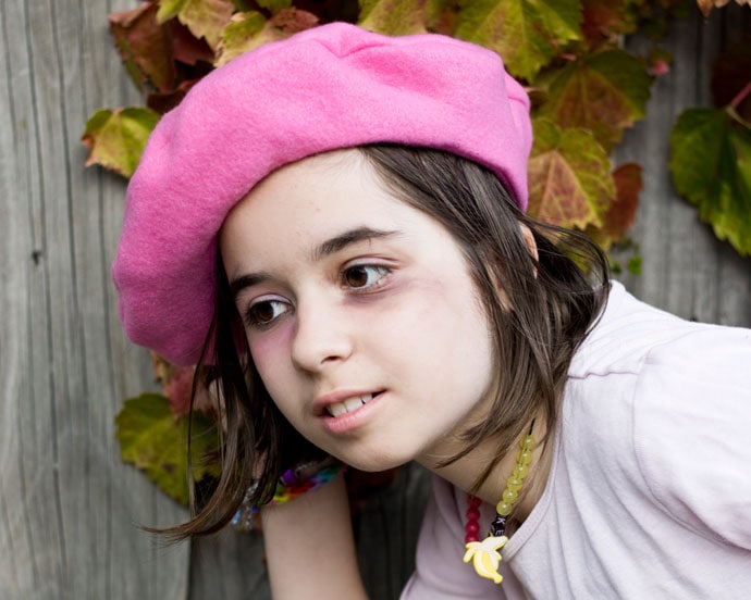 girl wearing a pink beret