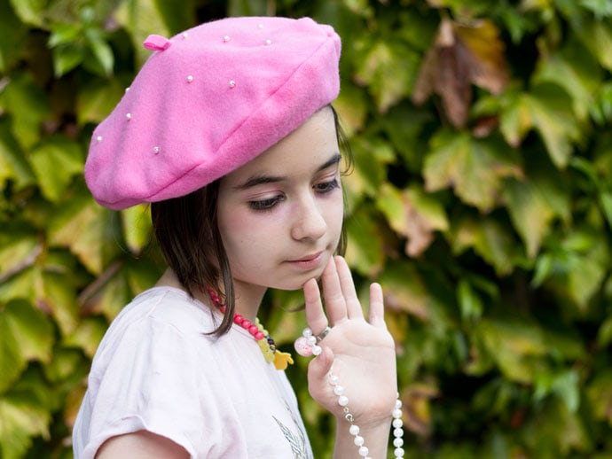 girl wearing a pink beret