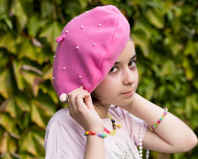 girl wearing a pink beret