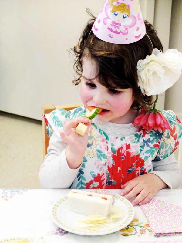 girl eating veggie flowers