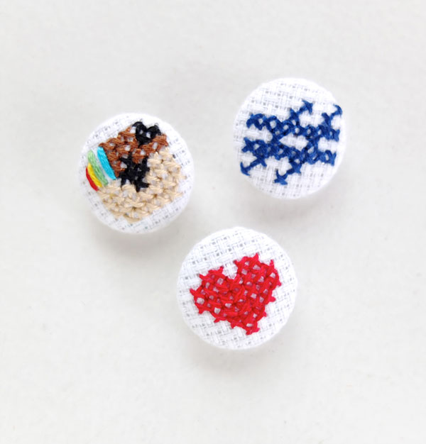 Fabric coverd buttons with cross stitch Instagram logo mypoppet.com.au